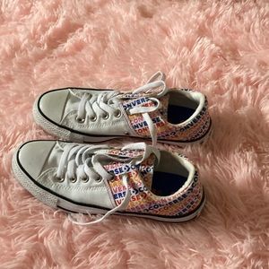 White converse with colorful letters